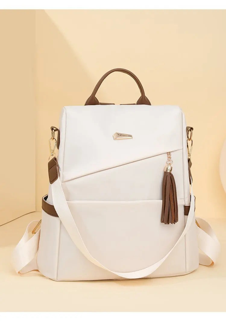 Damen-Rucksack aus Nylon mit Quaste und rückseitigem Reißverschluss